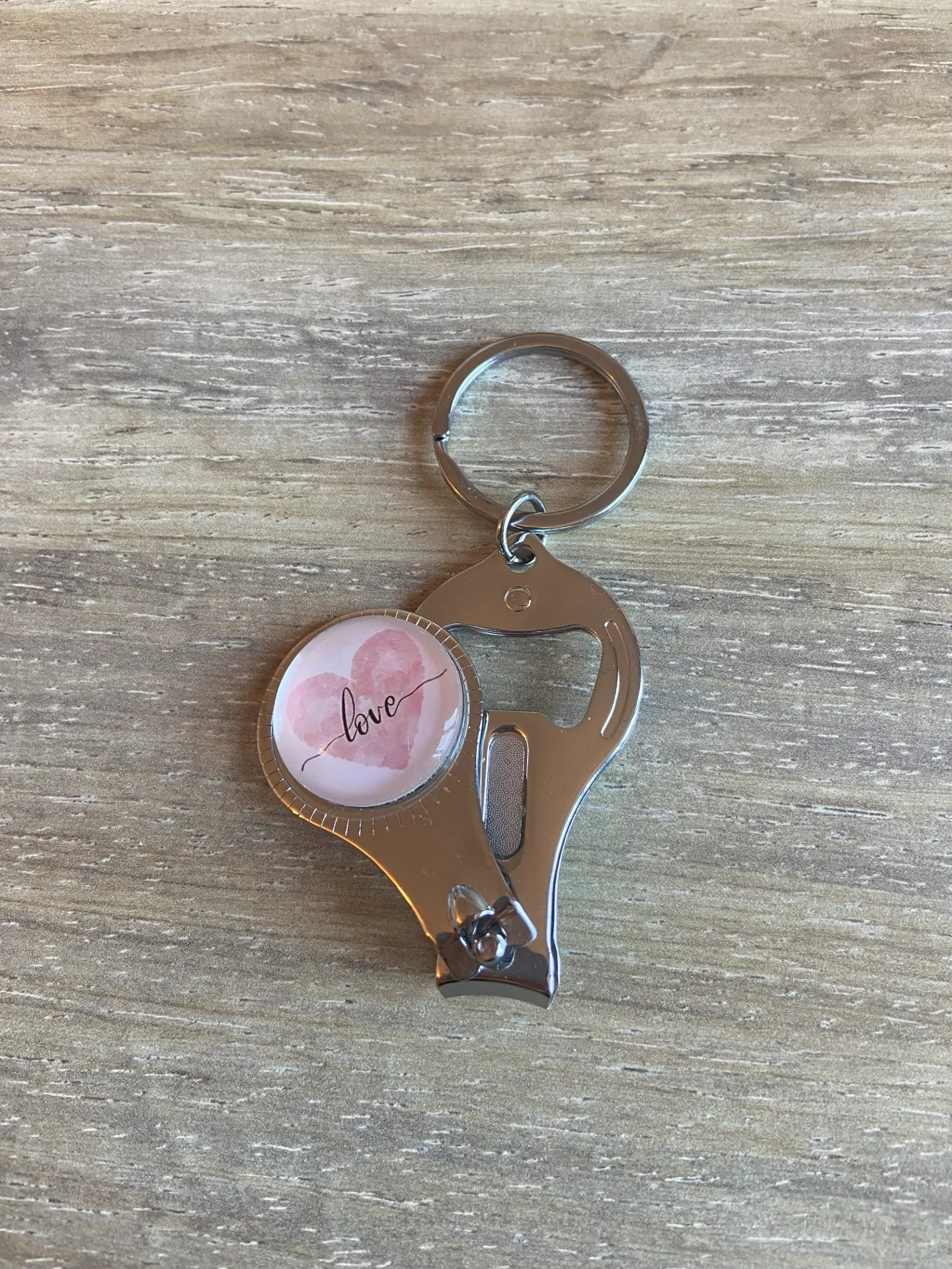 Porte-clé décapsuleur et coupe-ongle love