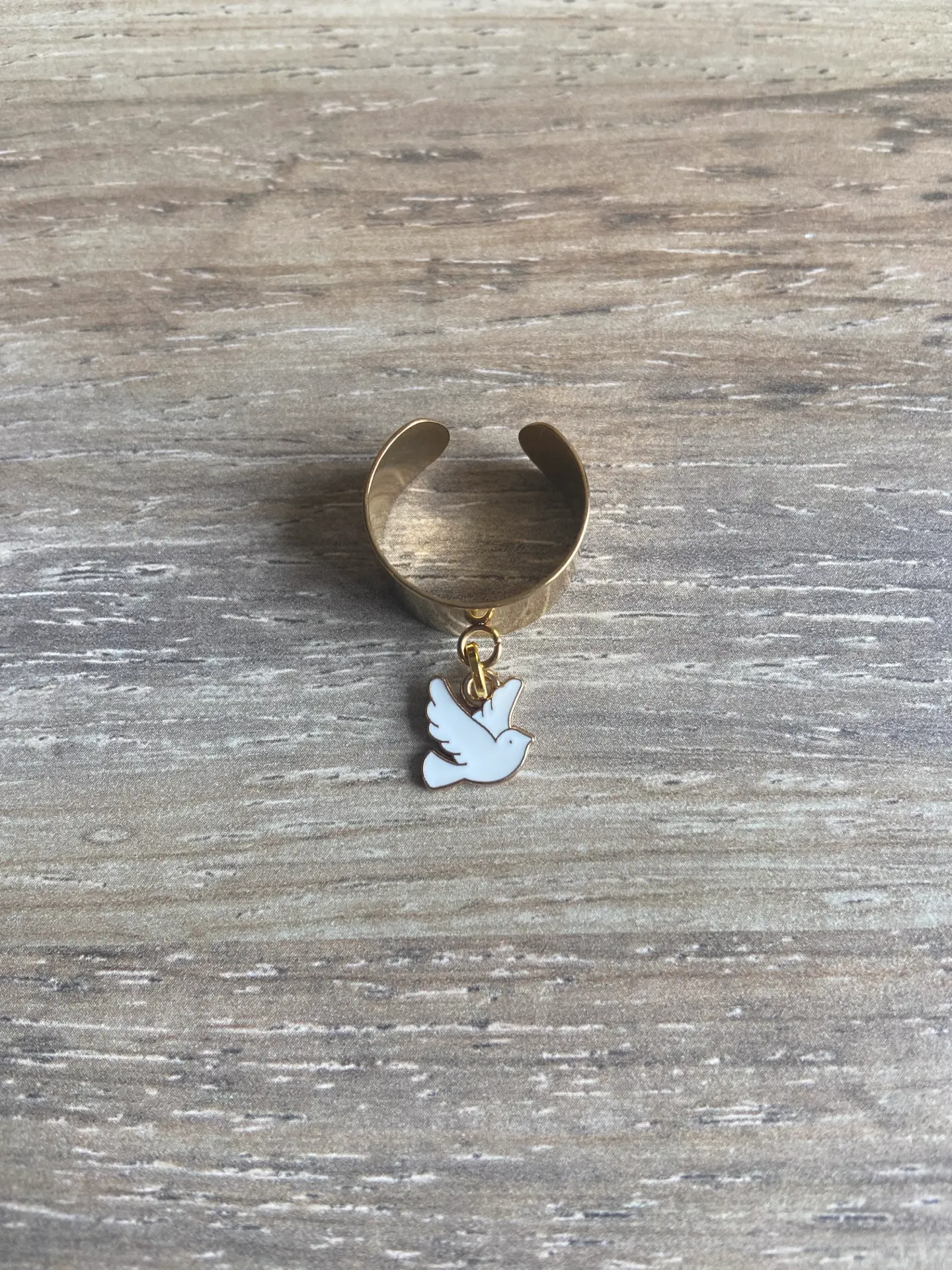 Bague dorée avec oiseau blanc en acier inoxydable