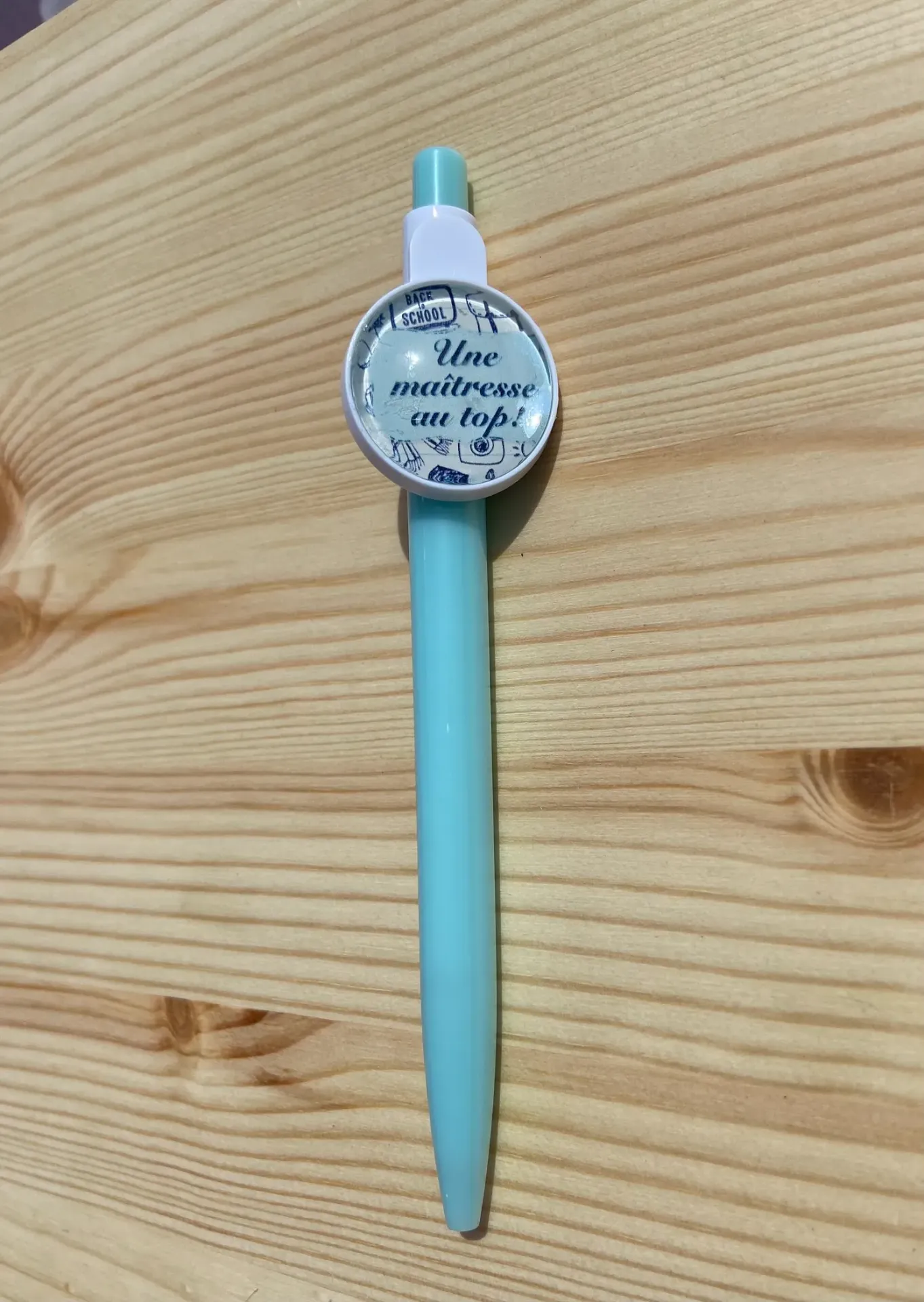 Stylo bleu "une maitresse au top"