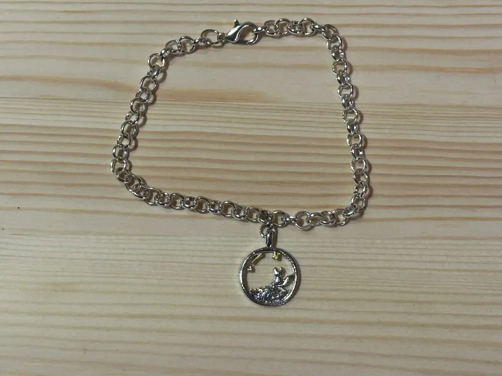 Bracelet en chaîne argenté avec breloque petit prince taille 17cm