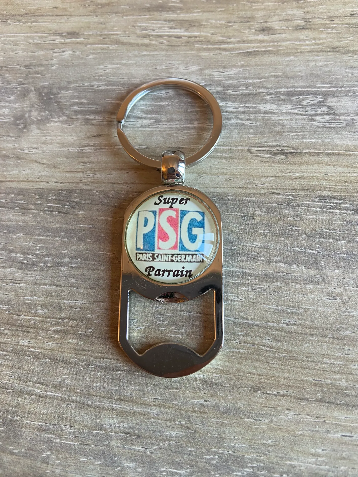 Porte-clé décapsuleur PSG "super parrain"