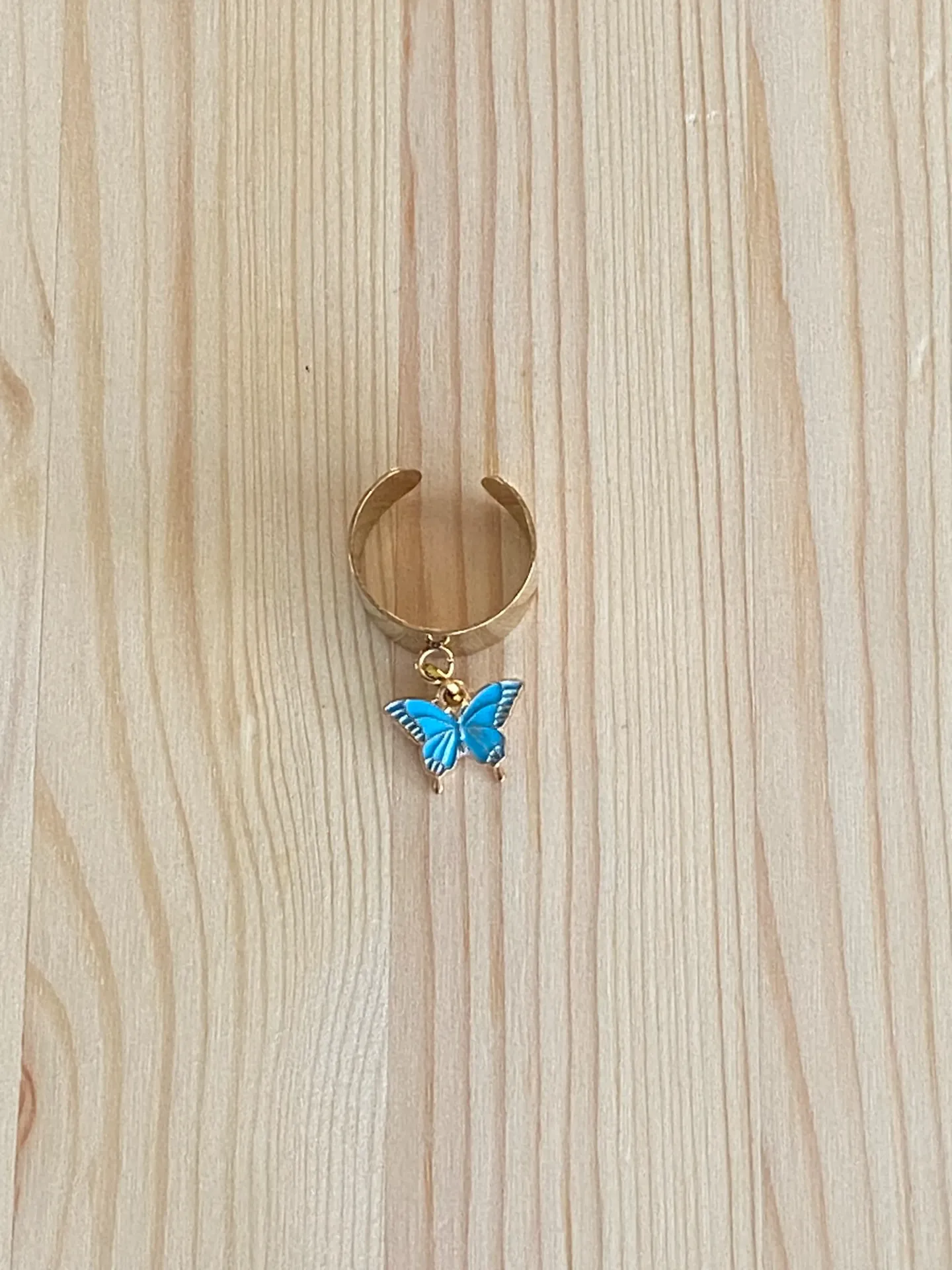 Bague dorée réglable avec papillon bleu en acier inoxydable