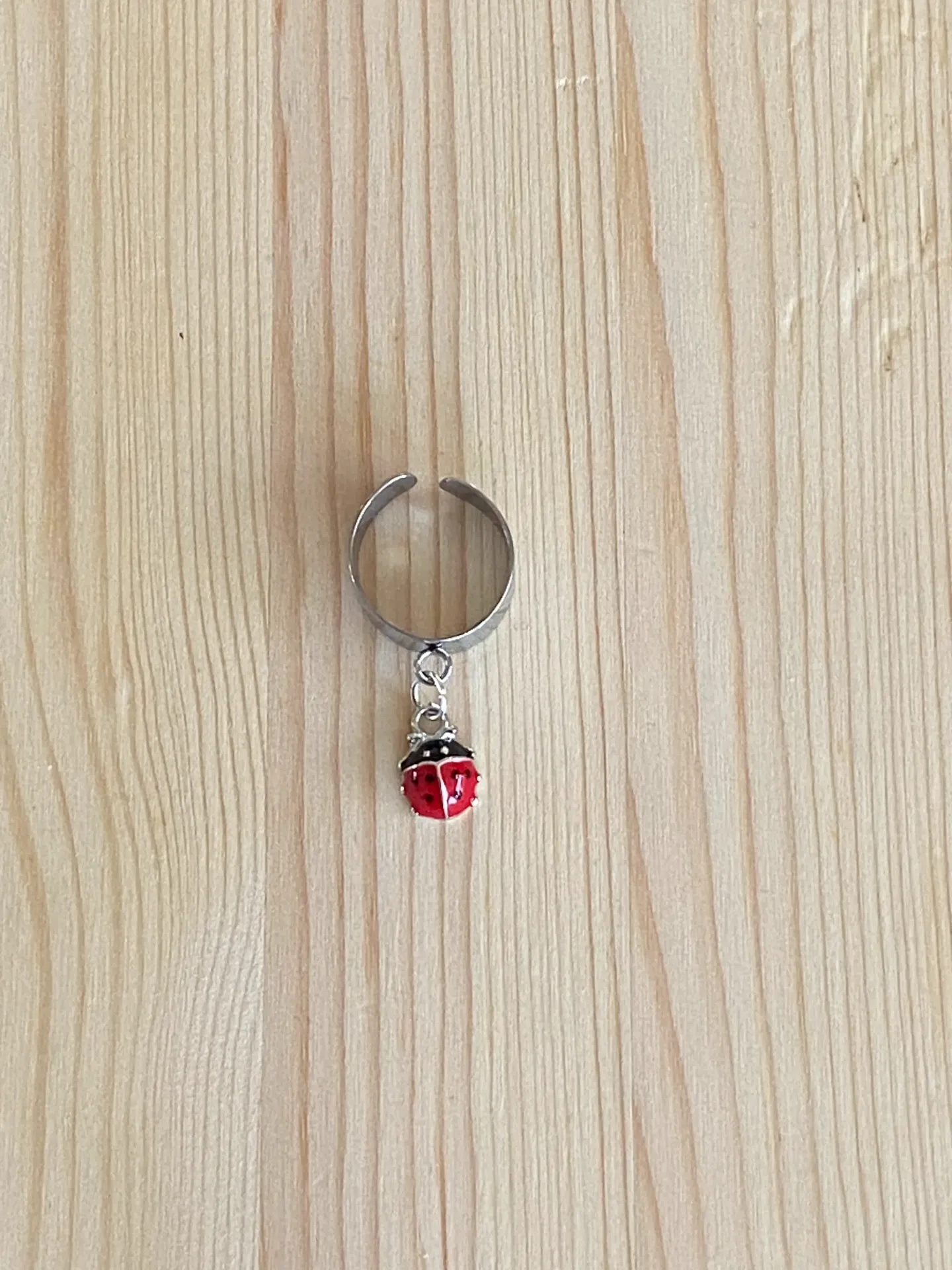 Bague argentée réglable coccinelle en acier inoxydable