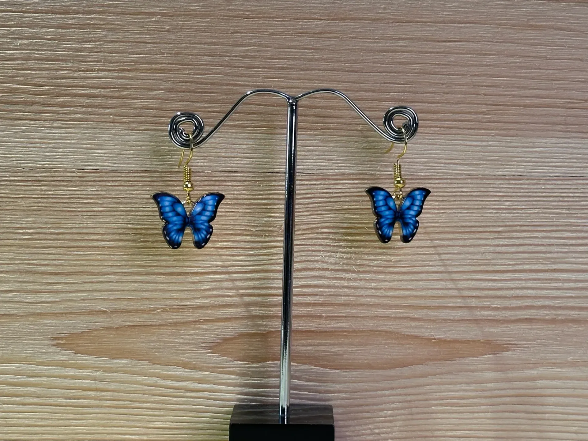 Boucle d'oreilles dorée papillon bleu en acier inoxydable